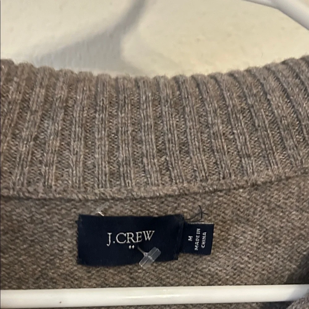 JCrew 100% Lambswool Sweater with a 1/4 zip at the neck.